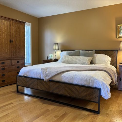 Retreat to the peaceful Master bedroom with adjoining bathroom. Natural wood tones and soft lighting ensure restorative sleep and sweet dreams.