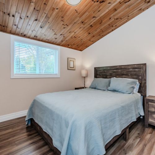 With soft bedding and simple decor, this bedroom ensures a comfortable and peaceful night's sleep.