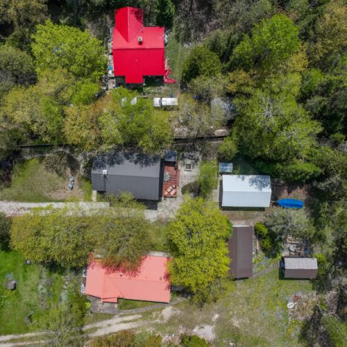 A closer aerial view showing the property and its immediate surroundings.