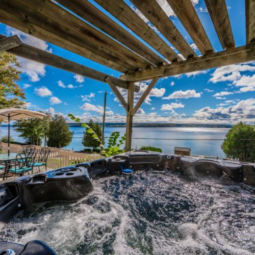Enjoy a relaxing soak in the hot tub while taking in the incredible, unobstructed views of the bay—an ideal spot for stargazing or sunset watching.