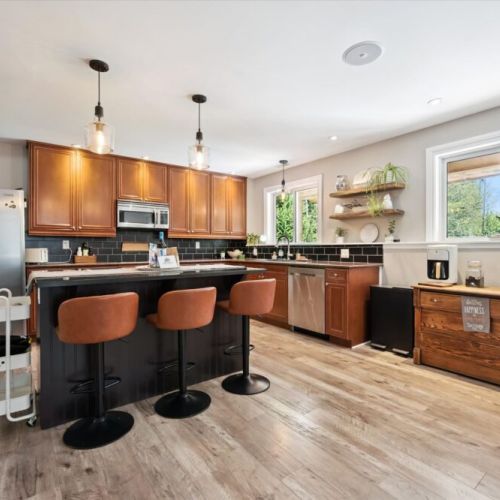 Spacious kitchen island with comfortable bar seating — perfect for casual meals, morning coffee, or gathering while cooking.