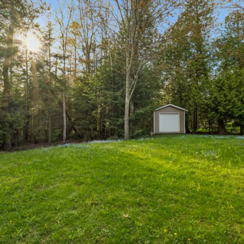 Surrounded by mature trees, the property offers a peaceful setting with room to spread out and unwind.