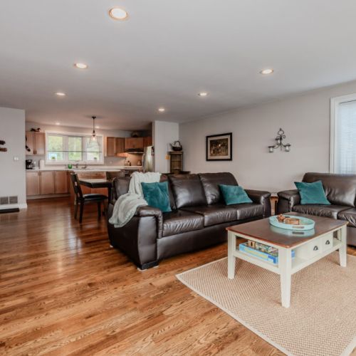 The bright, open living space with hardwood floors, comfortable seating, and tasteful décor creates a welcoming retreat. Perfect for relaxing after a day of kayaking, hiking, or exploring the Bruce Peninsula’s natural wonders.