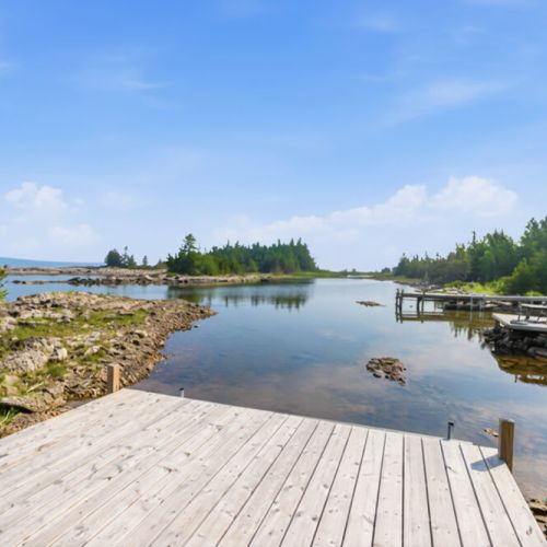 Step onto the dock and enjoy peaceful water views and easy lake access. Ideal for swimming, paddling, and relaxed waterfront travel.