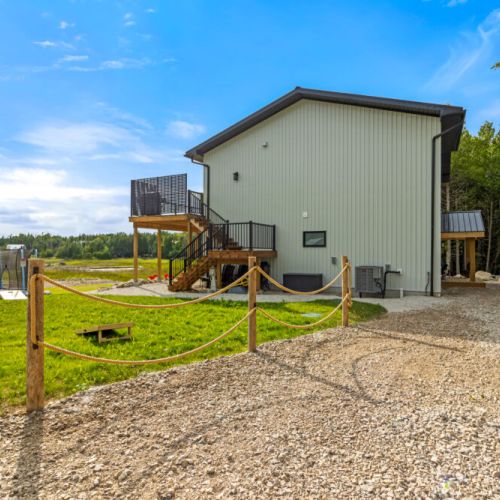 The side yard offers easy access to the deck, backyard, and outdoor amenities.