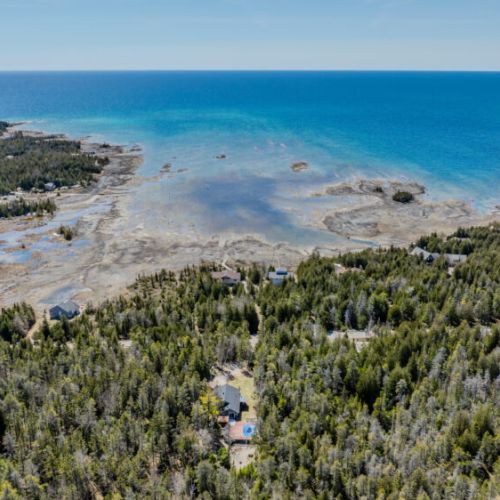 Stunning aerial view of the Bruce Peninsula coastline—perfect for nature lovers, beach explorers, and outdoor adventurers seeking peaceful cottage getaway