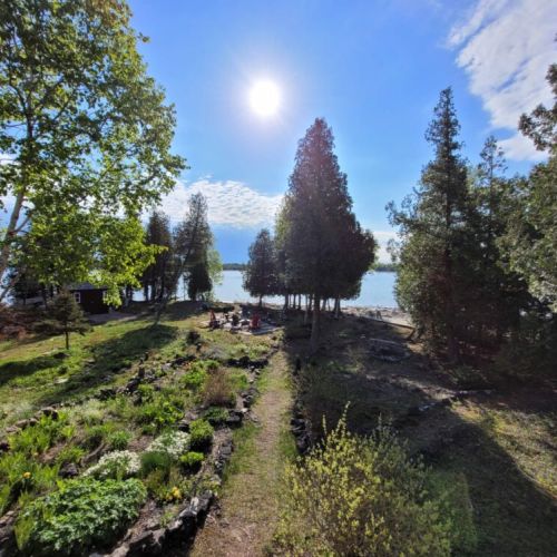 DeLana features a large 3 acre lot surrounded by water.