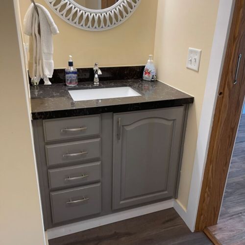 The chic bathroom vanity with ample counter space and a large mirror makes getting ready a breeze.