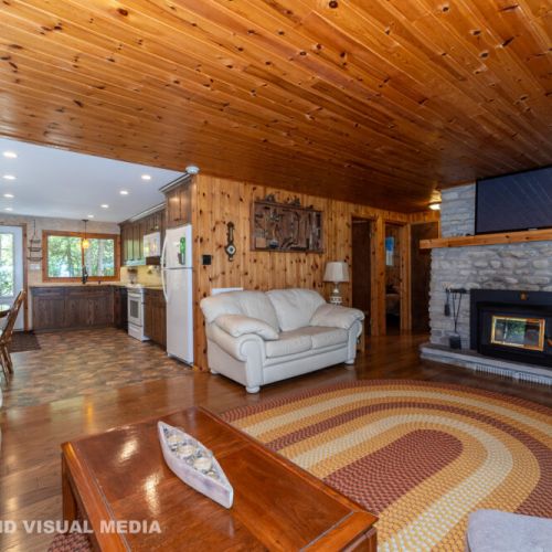 Bright and open living space with cozy seating, natural wood throughout, and great flow for groups.