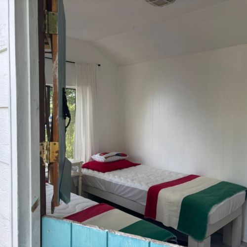 Bright and simple with two twin beds, perfect for extra guests or kids.