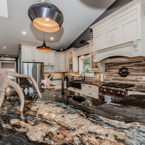 Cook like a chef in a luxury kitchen with granite counters, top-tier appliances, and charming coastal touches—an ideal space for entertaining during your cottage escape.