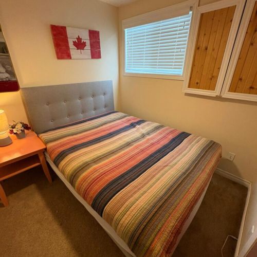 Comfortable bedroom with a warm, cottage feel and a relaxing place to recharge.