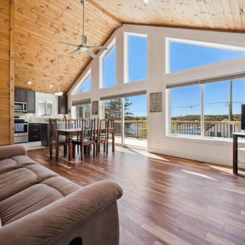 Floor-to-ceiling windows fill the great room with natural light while showcasing beautiful views of Georgian Bay.