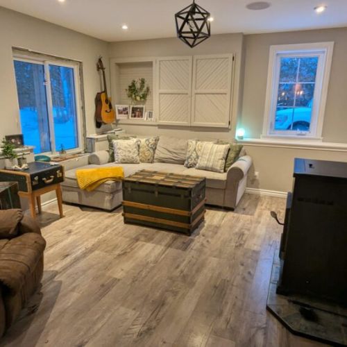 Comfortable sectional seating with large windows and natural light — perfect for relaxing after a day of exploring.