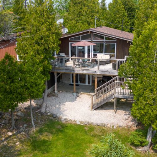 The upper backyard patio with BBQ is the perfect place to enjoy an outdoor meal, without missing the sights.