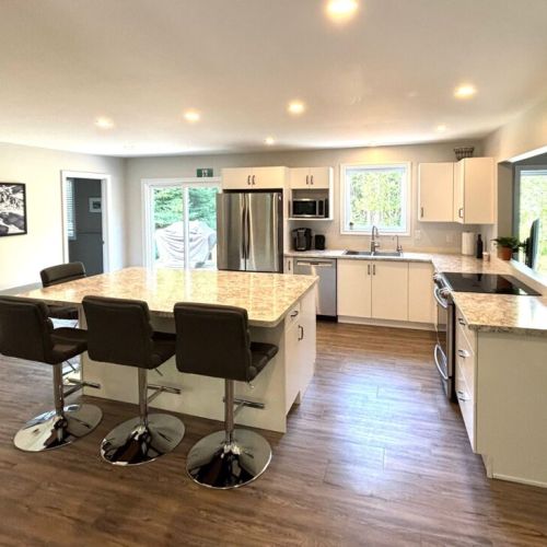 Another look at the kitchen’s open layout—bright, functional, and designed for connection.