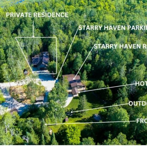 Starry Haven Cottage is a peaceful escape in the forest, featuring a cozy residence with an outdoor hot tub, campfire, and a nearby frog pond. Surrounded by lush greenery, it offers a perfect blend of comfort and nature under the starry skies.