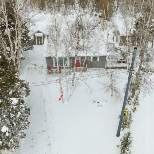 Aerial view of Miller Lake Maple Retreat tucked quietly among the trees.