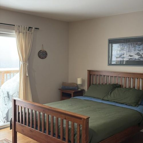 Enjoy the comfort of the ground-level primary suite, featuring direct deck access and stunning bay views. Start your day with morning coffee on the deck, taking in the serene waters of Georgian Bay and the peaceful ambiance of the Bruce Peninsula.