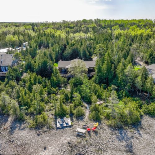 Enjoy a rustic outdoor experience at this fire pit area, surrounded by the beauty of nature and offering a perfect spot for evening gatherings under the stars.