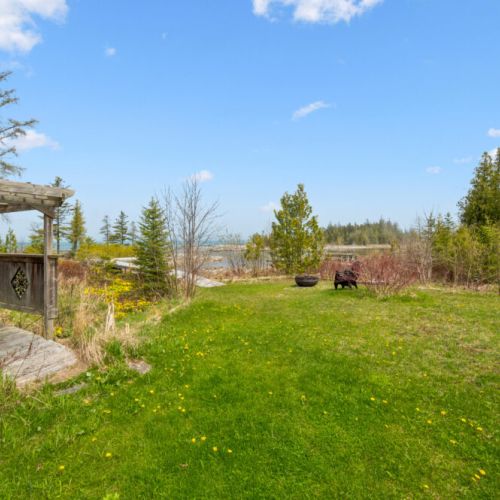 Open green space with waterfront views and room for everyone to enjoy the outdoors.