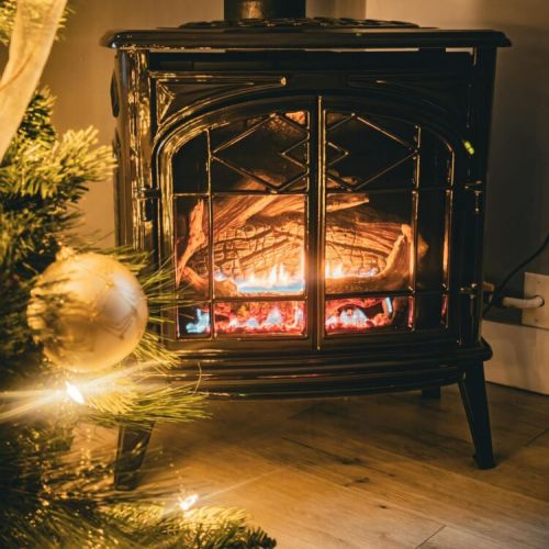 Gather by the warm glow of the fireplace, twinkling lights, and festive charm at Sunset Bay.