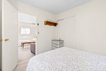 A comfortable main-floor bedroom offering a quiet place to recharge after a day of exploring.