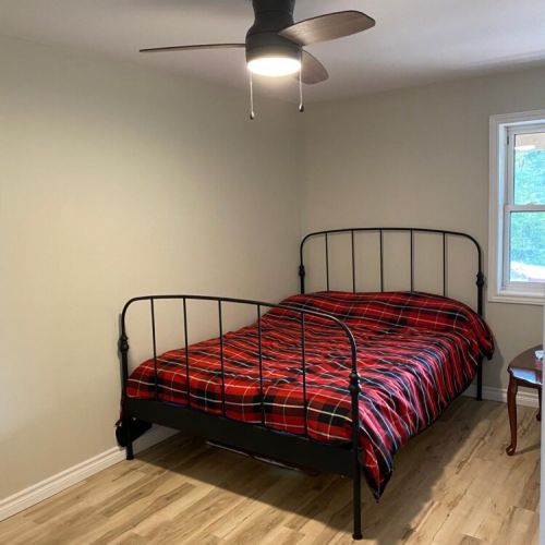 This inviting bedroom offers a simple, comfortable retreat after a day of lake adventures.