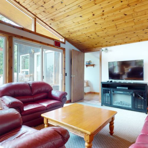 Enjoy easy access to the wrap-around deck from. the living room.