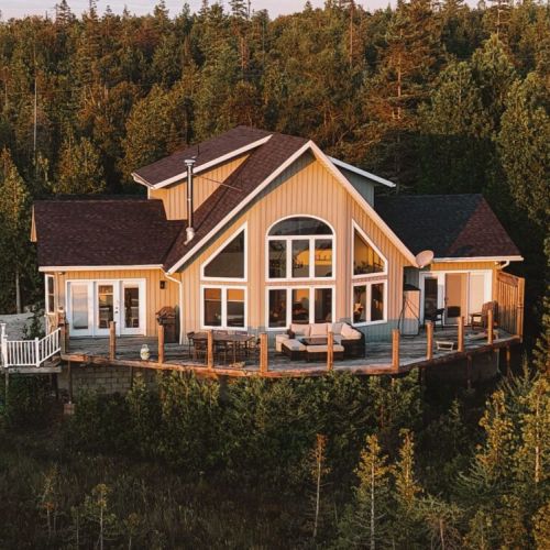 A private waterfront sanctuary nestled in cedar forest — Driftwood’s elevated design blends seamlessly into Tobermory’s rugged Lake Huron shoreline.