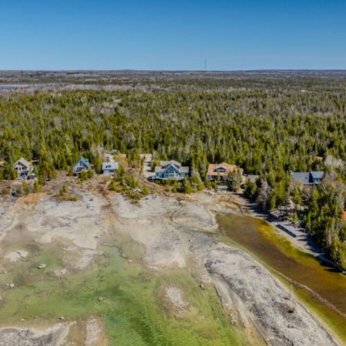 Cozy up in a charming lakefront community with unbeatable shoreline access and breathtaking views.
