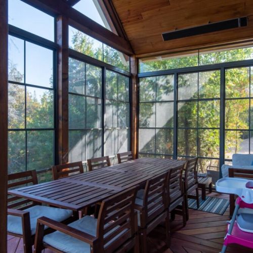Dine al fresco without the bugs—our screened-in Muskoka room is perfect for evening meals or family game nights.