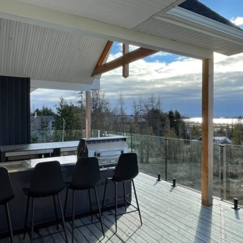 The upper veranda Kitchen Aid BBQ lounge and dining area.