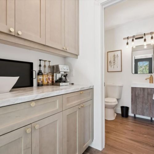 Convenient coffee station and bathroom access for easy mornings at the cottage.