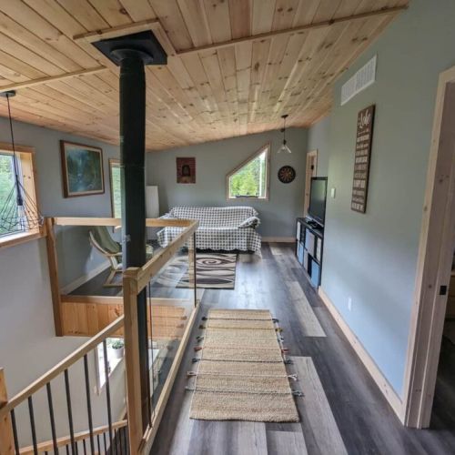 Inviting nook with a wood stove for chilly nights—ideal for reading, journaling, or simply unwinding after a day of exploring.