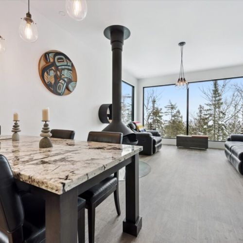 An open-concept dining and living space designed for easy gathering, shared meals, and relaxed evenings after a day of exploring the peninsula.
