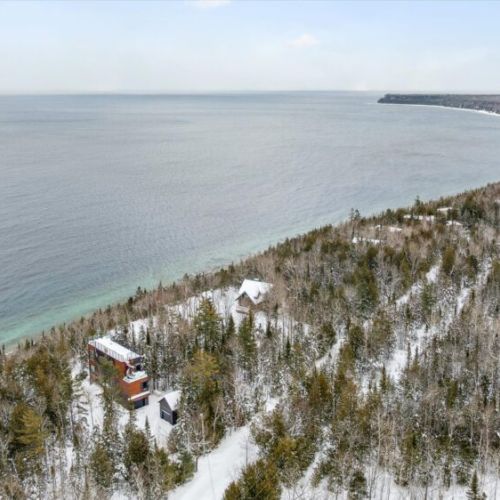 Surrounded by trees and close to Georgian Bay, the home feels secluded and quiet while remaining just minutes from Lion’s Head and the shoreline.