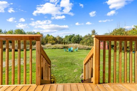 Step off the deck and into the expansive backyard, with the firepit just a short walk across the lawn.