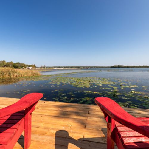 Settle into the red Adirondack chairs and enjoy a front row seat to the bay.