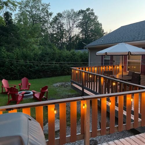 Gather around the fire pit for relaxing evenings, with the deck’s glowing lights adding a magical ambiance to your outdoor experience.
