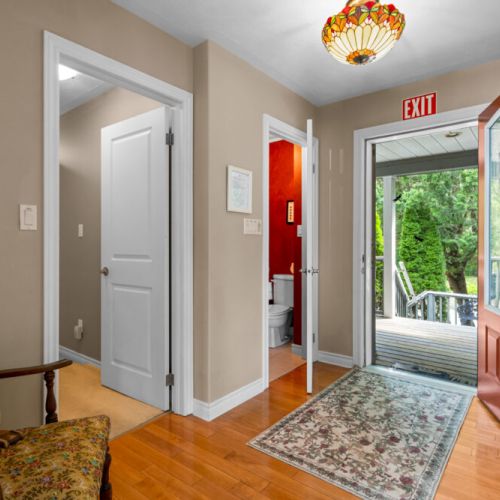A welcoming entryway offers convenient access to the deck and the home’s comfortable main living spaces.