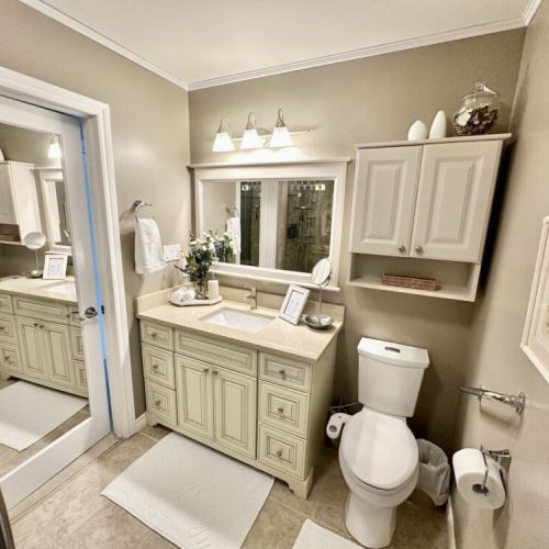 Spacious bathroom with a large vanity, ample counter space, and complimentary bath essentials.