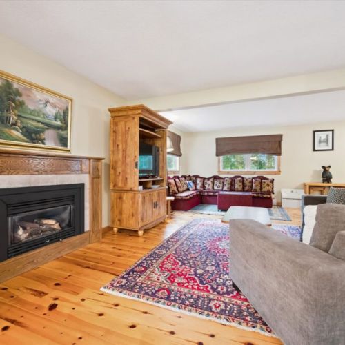 Gather around the fireplace, enjoy a movie night, or unwind with a good book in this welcoming living space.