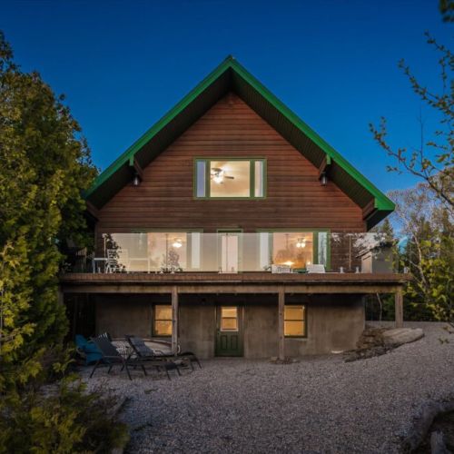 Enjoy sunset views and fresh air from the spacious waterfront deck complete with BBQ and lounge seating.