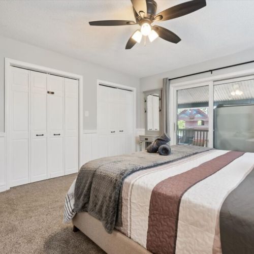 Comfortable guest bedroom with soft linens, ample storage, and peaceful cottage-inspired décor.