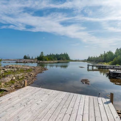 Private dock steps from your cottage — launch a kayak, take a refreshing swim, or simply soak up the peaceful waterfront views.