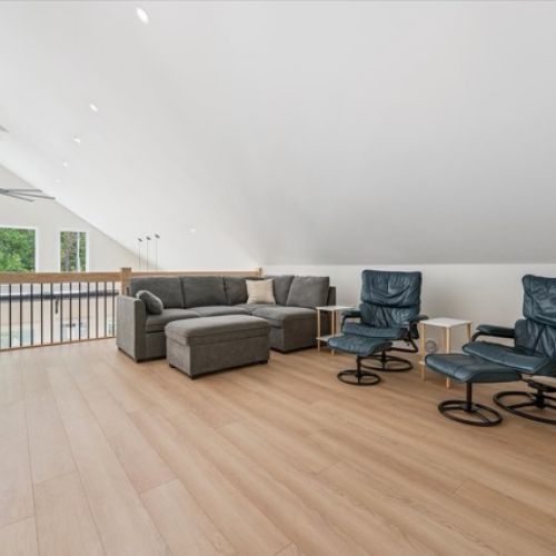 A comfy sectional and reclining chairs provide the perfect spot for reading, movie nights, or quiet conversation.