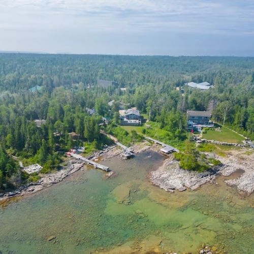 Bird’s-eye view of the quiet cove and surrounding area — calm waters, natural beauty, and space to explore.
