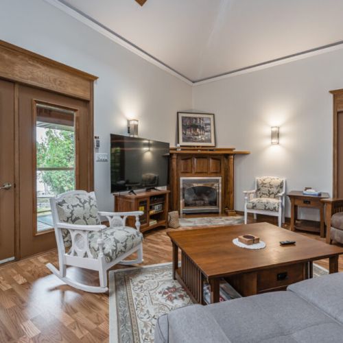 Turn on the fireplace for those cool nights while watching your favourite show on the smart TV, or simply curl up with a book or enjoy cocktail hour while being served from the kitchen island.