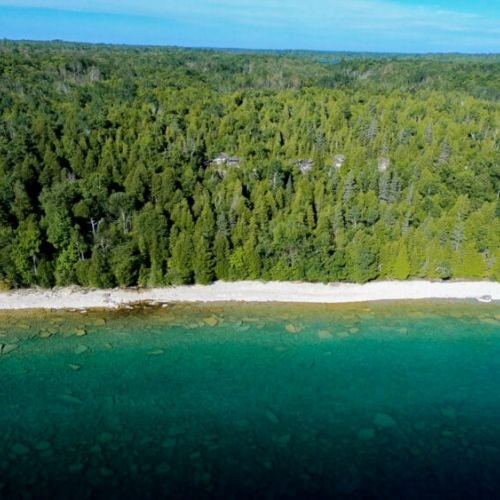 Where the lush green of the North Bruce forests meets the crystal-clear waters of Georgian Bay, a sanctuary of natural beauty and peaceful contemplation.